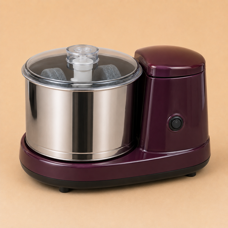 Wet grinder with stainless-steel drum and transparent lid.